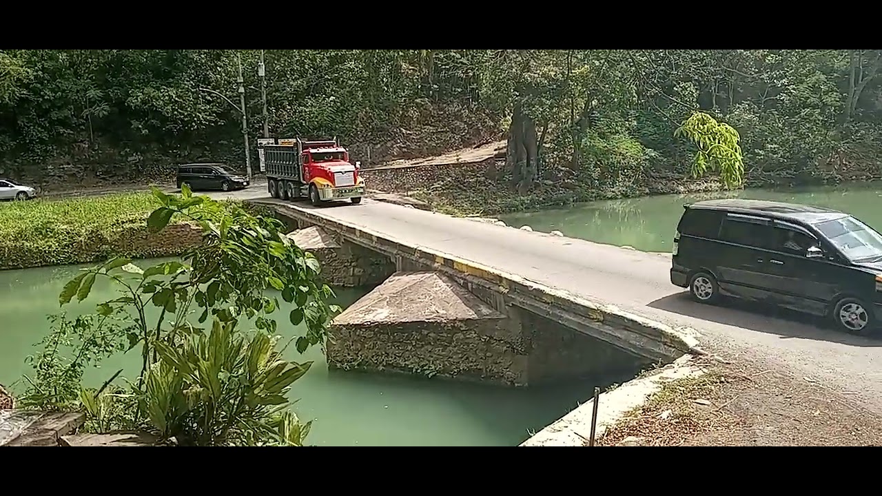truck going across flat bridge bridge