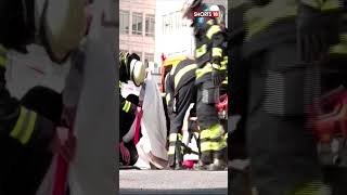 Germany News | German Climate Protestor Glues Hand To Street | Climate Change | News18 #shorts