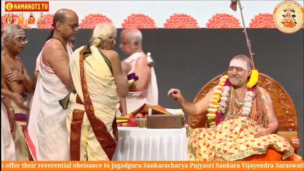 Vidwans of Sringeri Mutt offering prasadam to Jagadguru Sankaracharya of Sri Kanchi Kamakoti Peetham