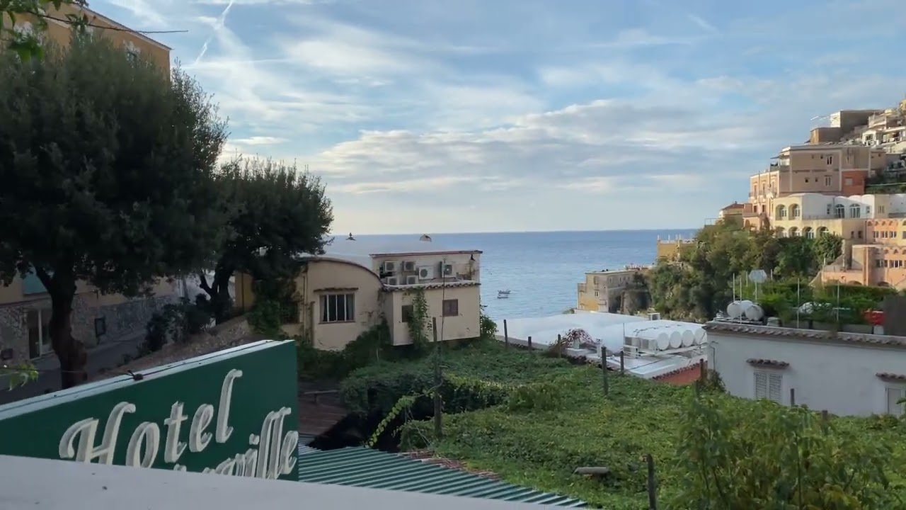 Eating breakfast on balcony of Hotel La Bougainville Positano, and enjoying the view of Positano