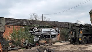 Tearing a car in half with two lorries
