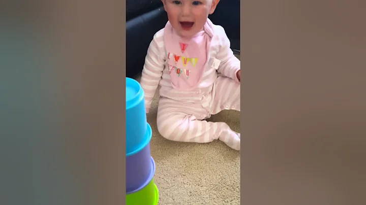 Baby giggling knocking tower & mammy falling