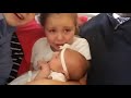 Little Girl Cries While Holding Baby Sister - 974529