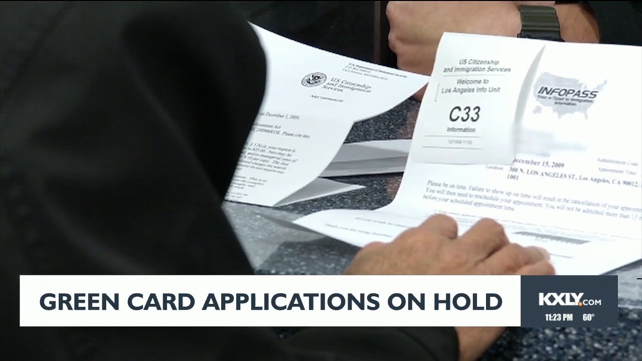 Green card applications on hold - YouTube
