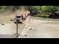 Road Train crosses Cahill’s Crossing with crocodiles watching