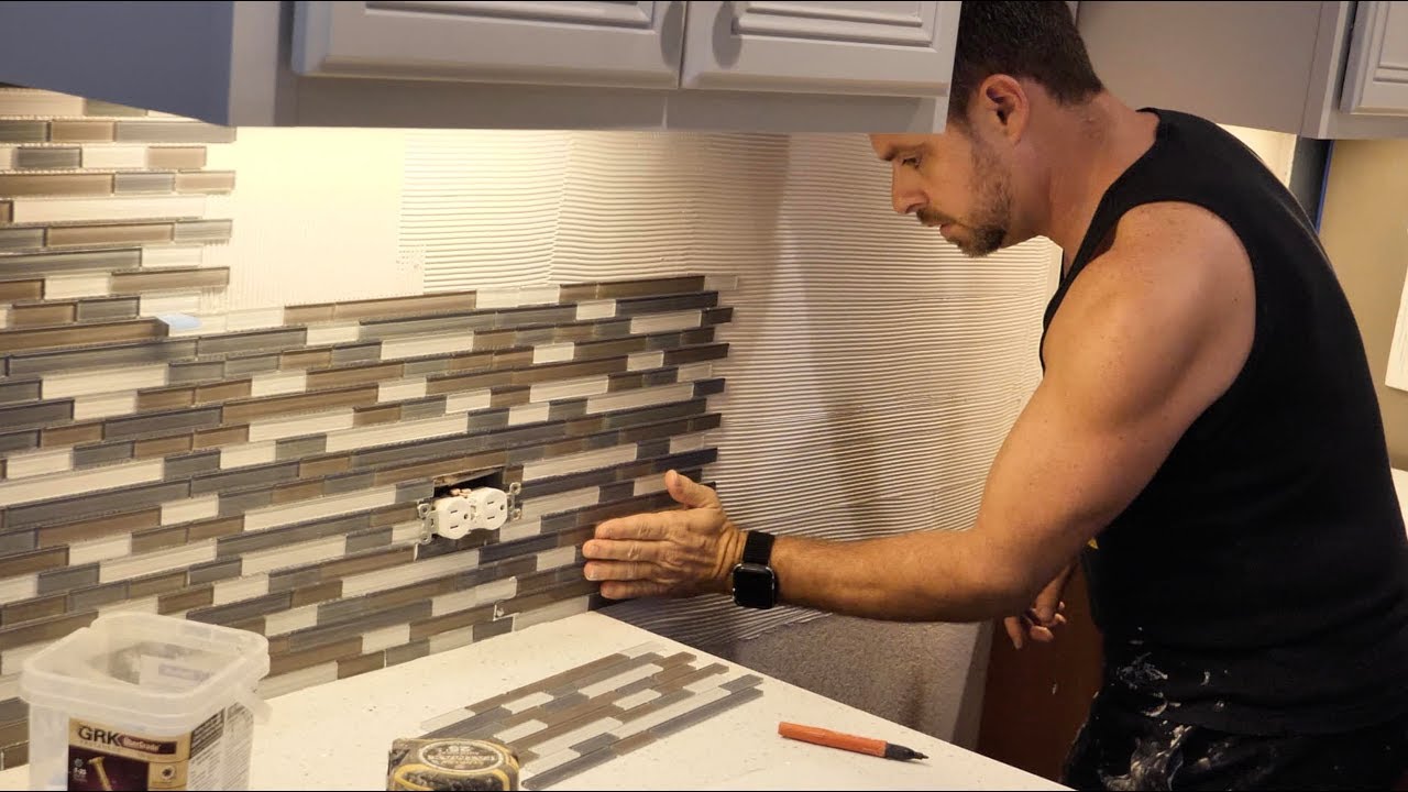Installing a backsplash in your kitchen or bathroom
