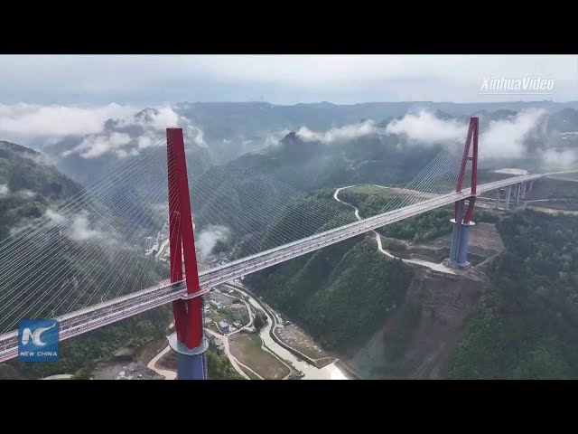 New towering bridge opens to traffic in China's mountainous Guizhou Province class=