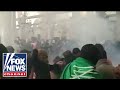 Rockets Explode Overhead During Fox News' Trey Yingst Report