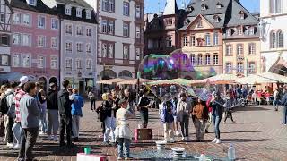 Street performer blowing bubbles by St Peter's Fountain in Trier, Deutschland  (Germany) town square by Jaymes Grossman 14 views 1 year ago 1 minute, 31 seconds