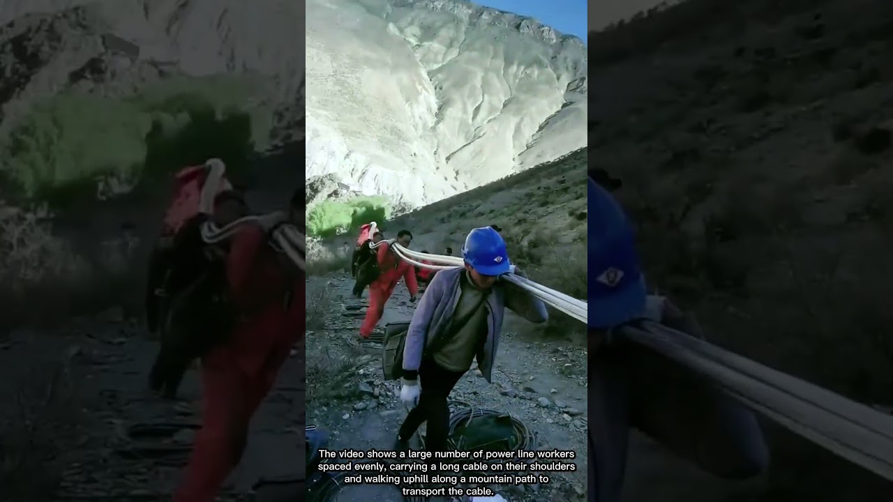 Spectacular Scene of Workers Carrying Power Cable Uphill