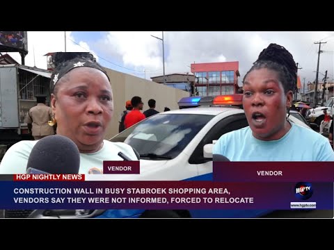CONSTRUCTION WALL IN BUSY STABROEK SHOPPING AREA,…………………