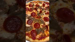 Pizza with the toppings of cheese, pepperoni and slice meat (beef) at Camillo’s restaurant
