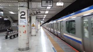 JR East E235 series 1000 series Sobu Line Local bound for Chiba; E259 series Narita Express passi...