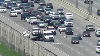 LIVE: Crews work overturned car on I-10W