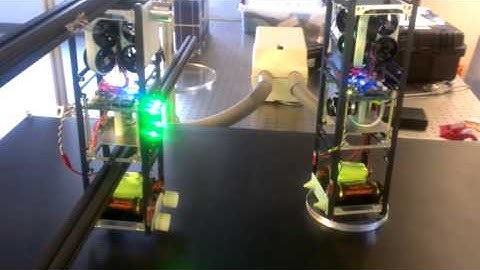 Vision-based nanosatellite magnetic docking control