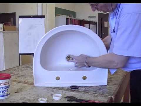 Fitting a slotted basin waste fitting