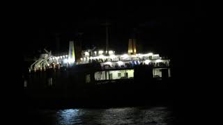 Night airplane and big ship in Crete, Heraklion, Greece