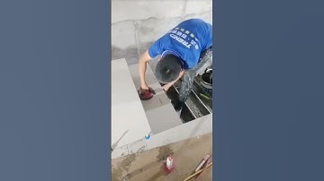 the process of installing plain white ceramic tiles on the stairs of a multi-storey building #shorts