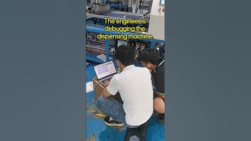 The engineer is debugging the dispensing machine.