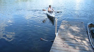 Entering and exiting a kayak at a dock using KayaArm