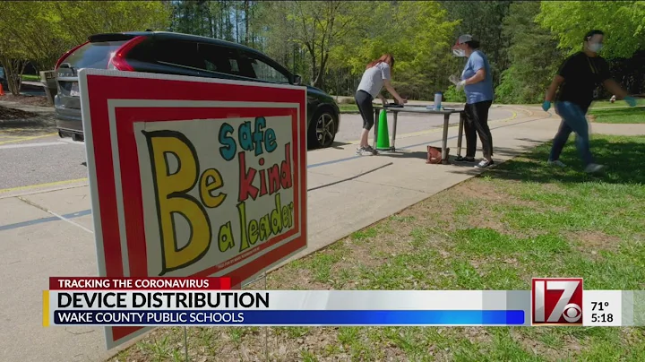 Wake County School employees handing out devices