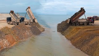 A Bulldozer Shantui Pushing Stone Enter The Sea And Big Trago Truck 25T Unloading