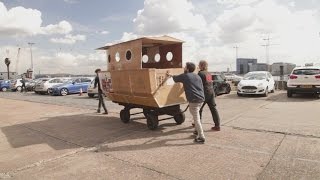 Cardboard houseboat hits the River Thames