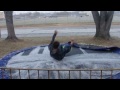 breaking ice on trampoline