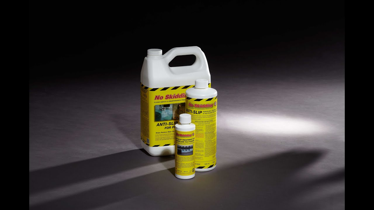 No Skidding® Anti-Slip Treatment on two identical wet tiles,  one treated & one untreated.