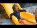 Funny Kids at Children&#39;s Waterpark Swimming Pool and Slides