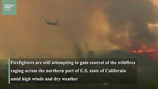Firefighters continue to battle California wildfires amid high winds
