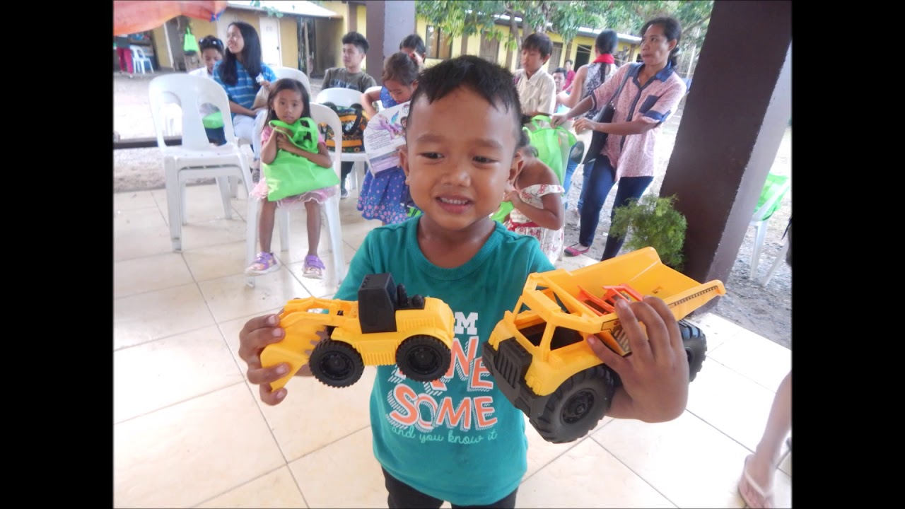 Giving Christmas gift at Refuge House 