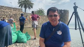 Volunteers from the Philippines clean up Sea of Galilee