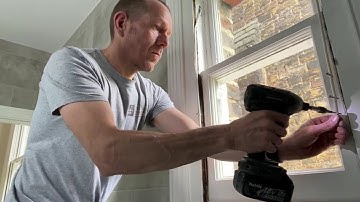 Screwing the cords and hanging the lower sash