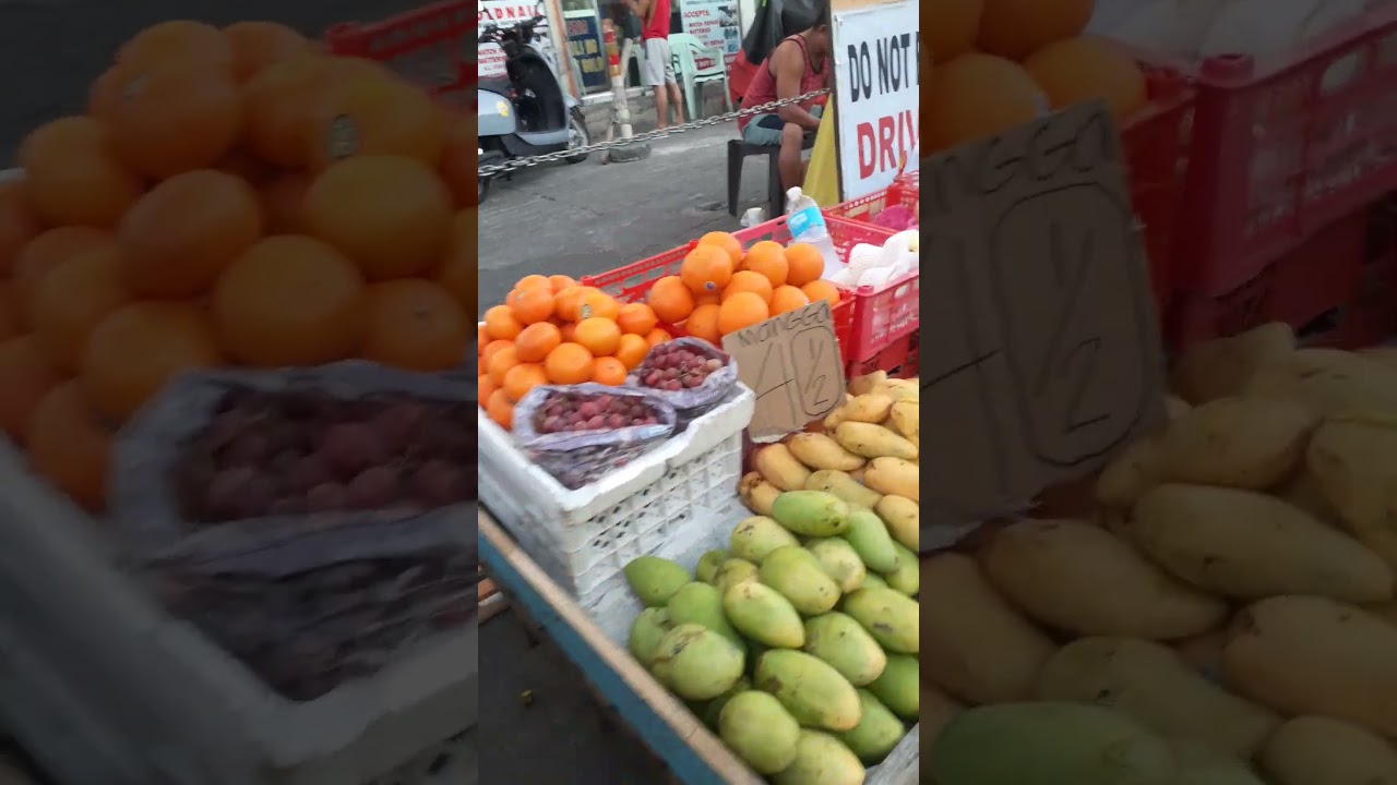 more kind of vegetables and fruits at sidewalk vendors. 