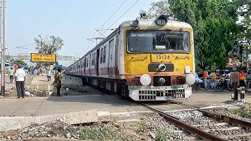 Dangerous situation at Rail Gate careless public crossing rail line casually front of local train