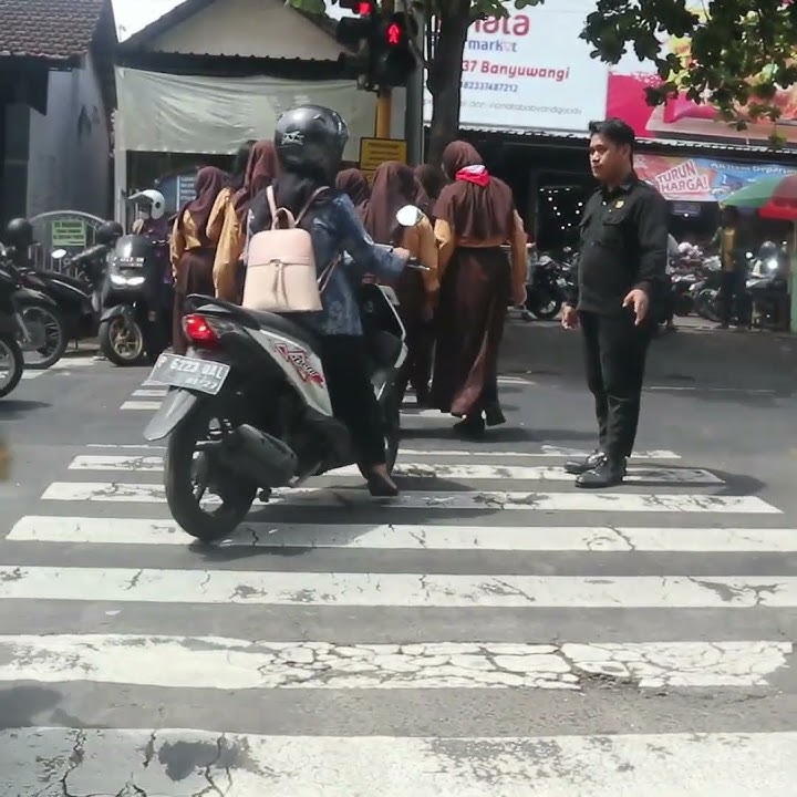 Stop.!! Please be patient, there are school children crossing the road.