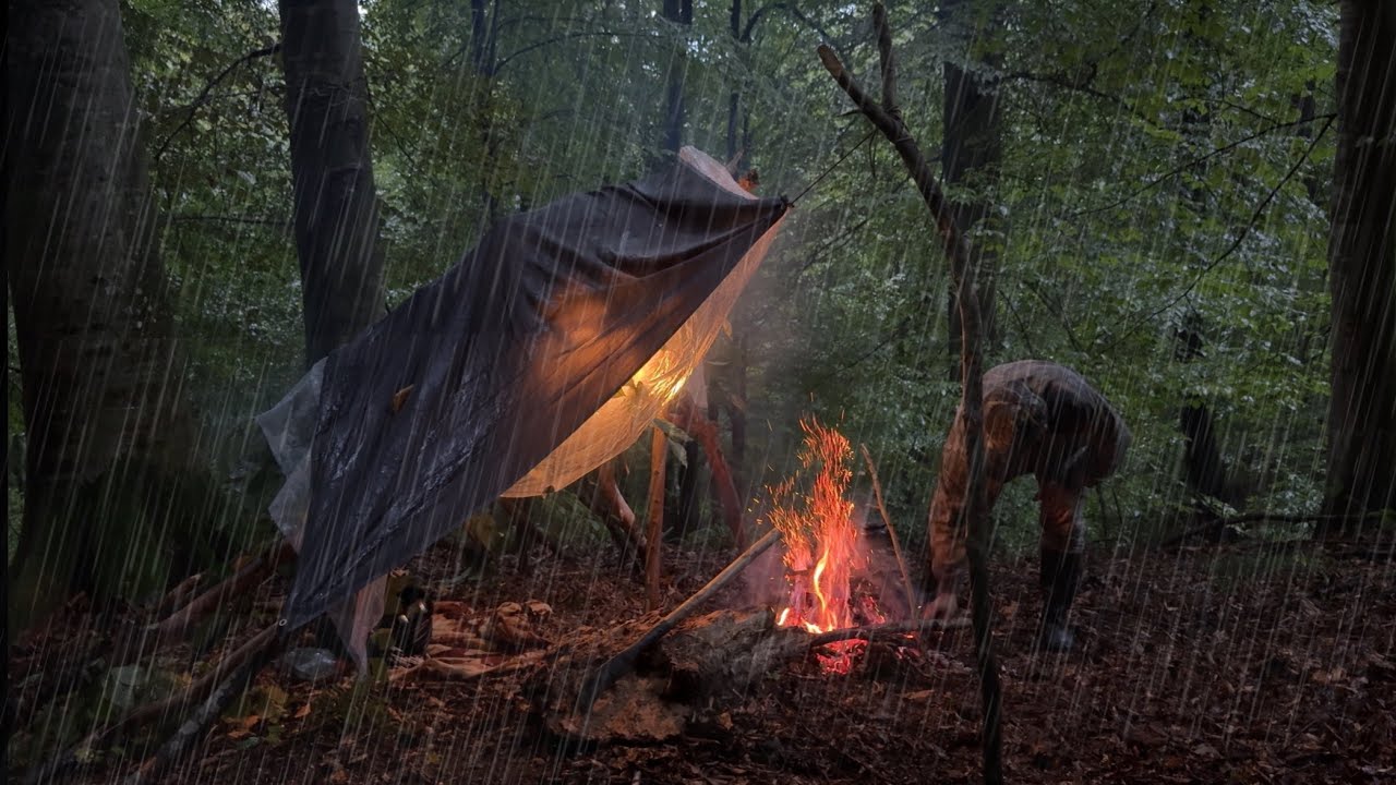 1 day camping in heavy rain and lightning and building a shelter and ...