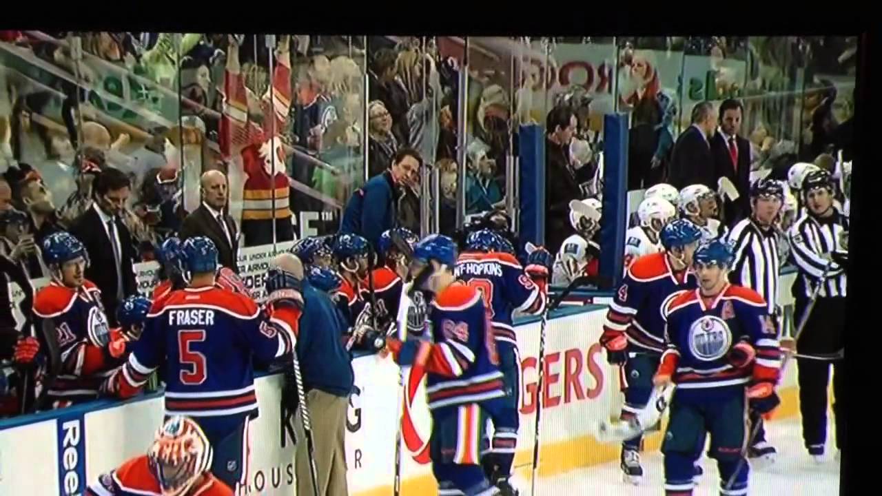 oilers fan throws jersey on ice