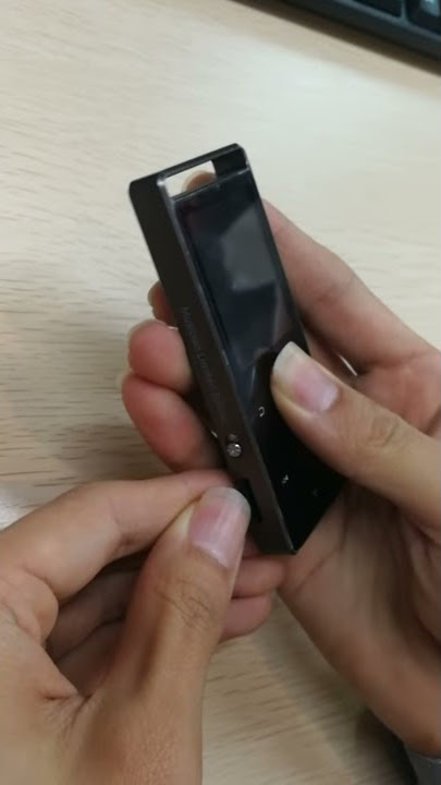 Insert SD card into AGPTEK A01T mp3 player
