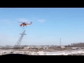 Helicopter picking up power line tower [HD]