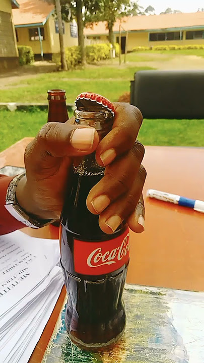Simplest way of opening a bottle of soda #opening a drink