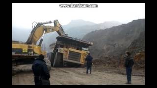 Pulling Dump Truck Cat 777D From The Mud