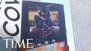 Controversy Erupts Over Clothing Company's Times Square Billboard Ad Depicting Hog-Tied Trump | TIME