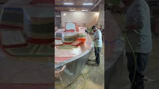 Spraying fresh gelcoat over the mold and our Aqua Steel flange to lock in a smooth durable surface