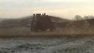 Redneck girl covered in cow slurry. New Holland