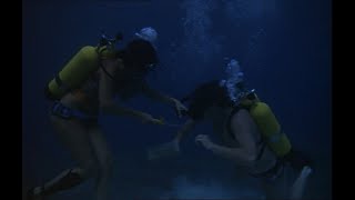Female Scuba Diver ambushes Male Diver 1960s