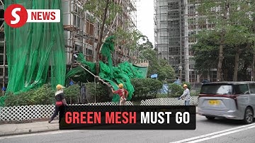 Hong Kong fire: Authorities rush to remove scaffolding nets from all buildings