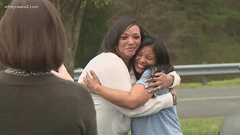 April Barber greeted by husband, son after release...