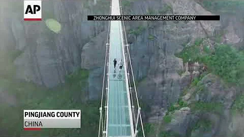 Raw tourists brave glass bottom bridge